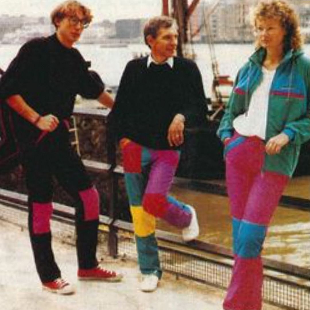 Three catalogue models wearing Cotswold clothing outdoors