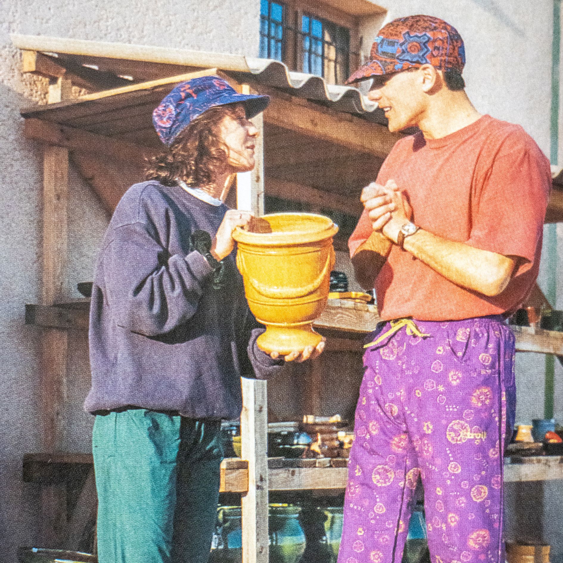 Two people wearing Cotswold clothing from the 1990s