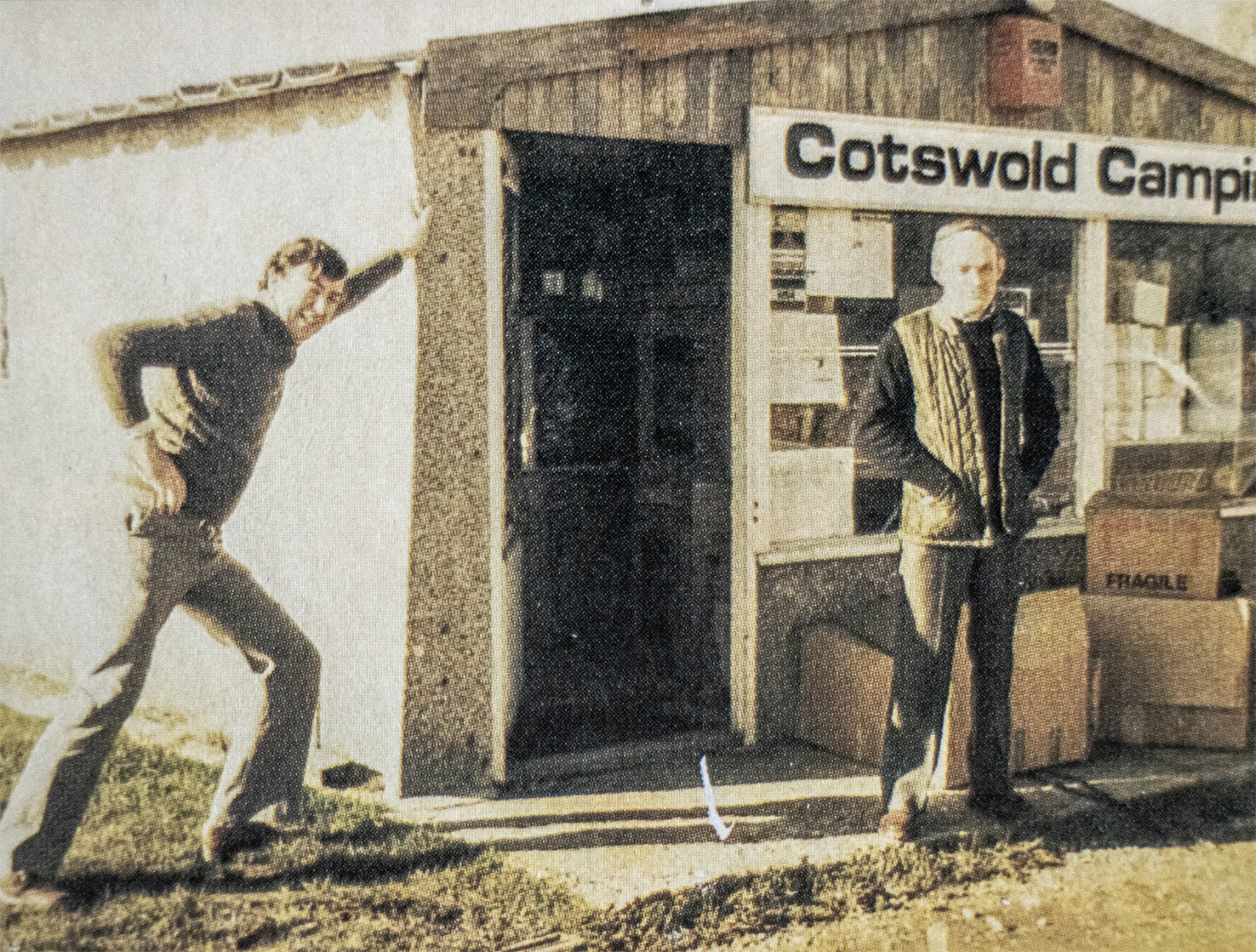 Two men outside the original Cotswold Camping store
