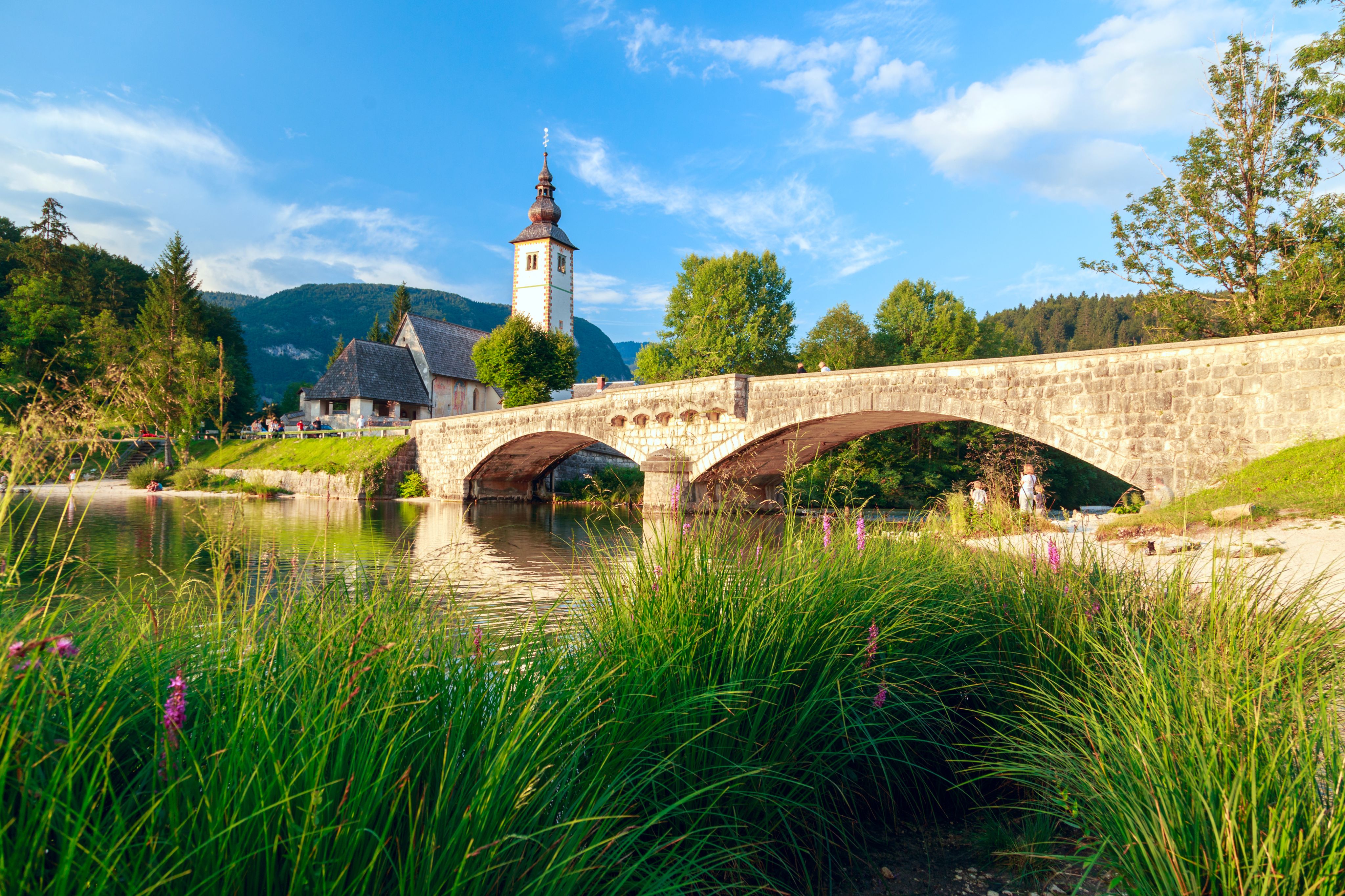 Church of St John the Baptist and a bridge by the Bohinj lake, Slovenia