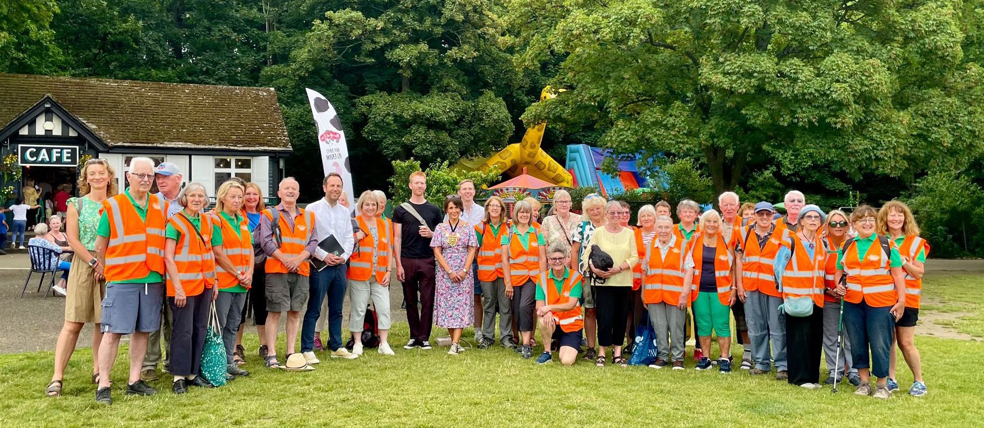 Group of Ramblers outside a cafe wearing high-vis vests