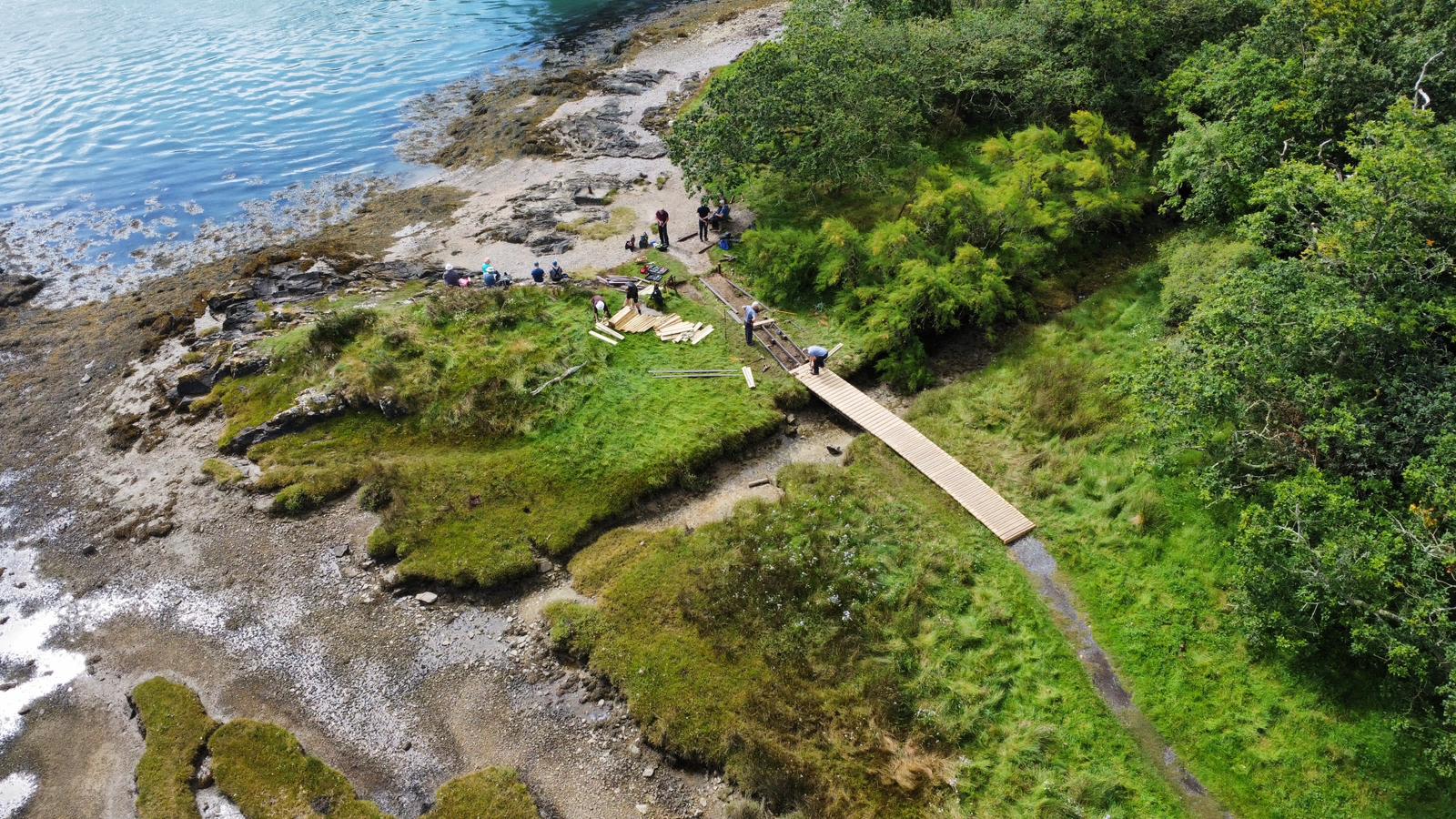 Drone photograph showing members of Ynys Mon Ramblers’ path maintenance team working on the boardwalk at Coed Mor Llanfairpwll