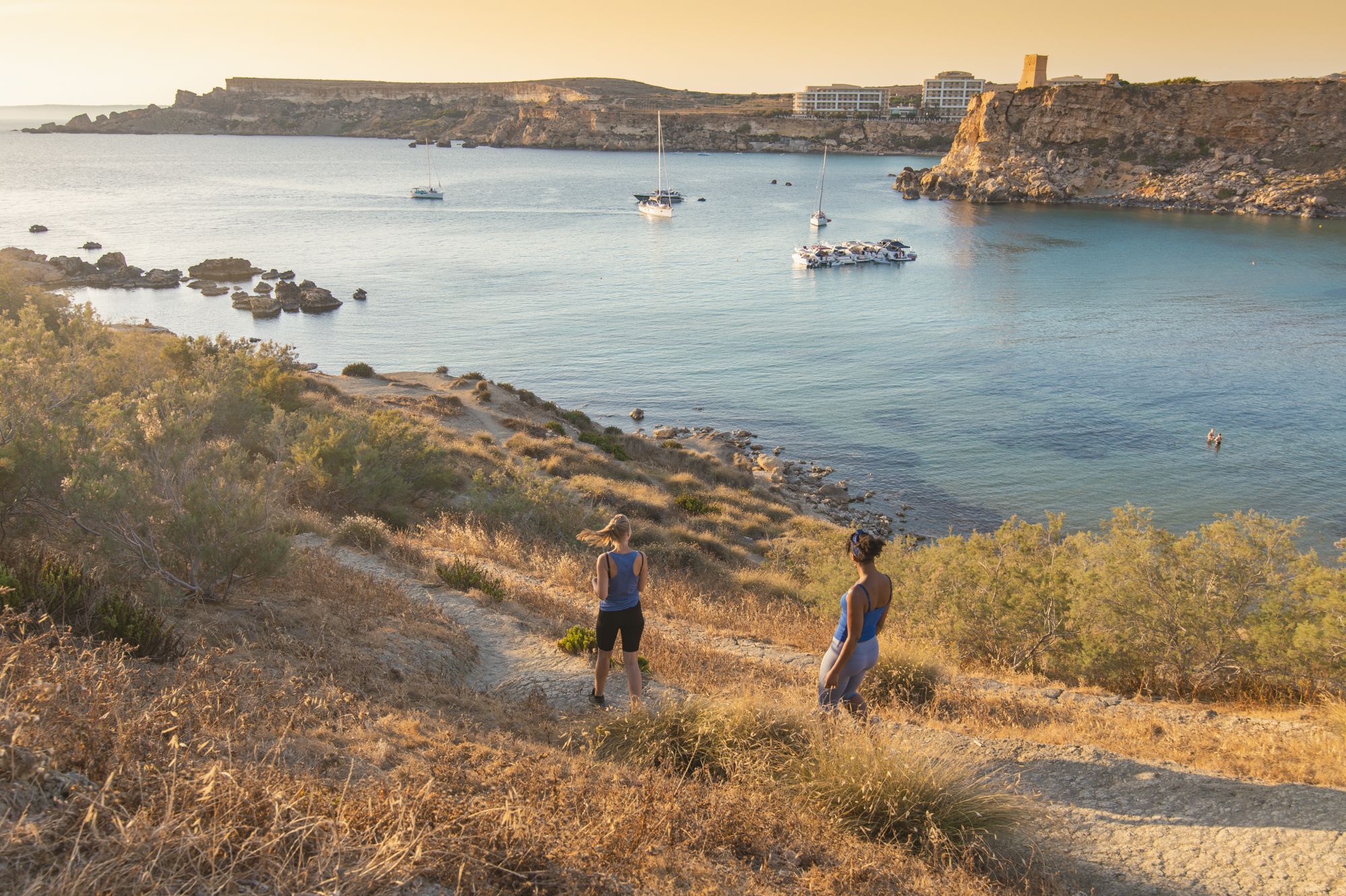 Two ramblers walking near Malta coast